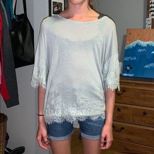 Lace detailed shirt that is gray green.